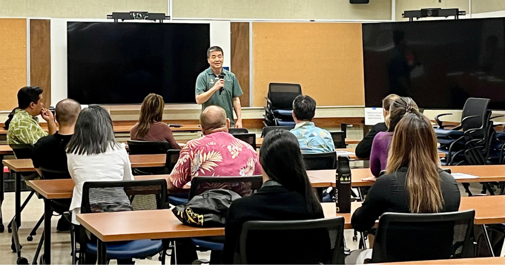 A man giving a presentation to a group.