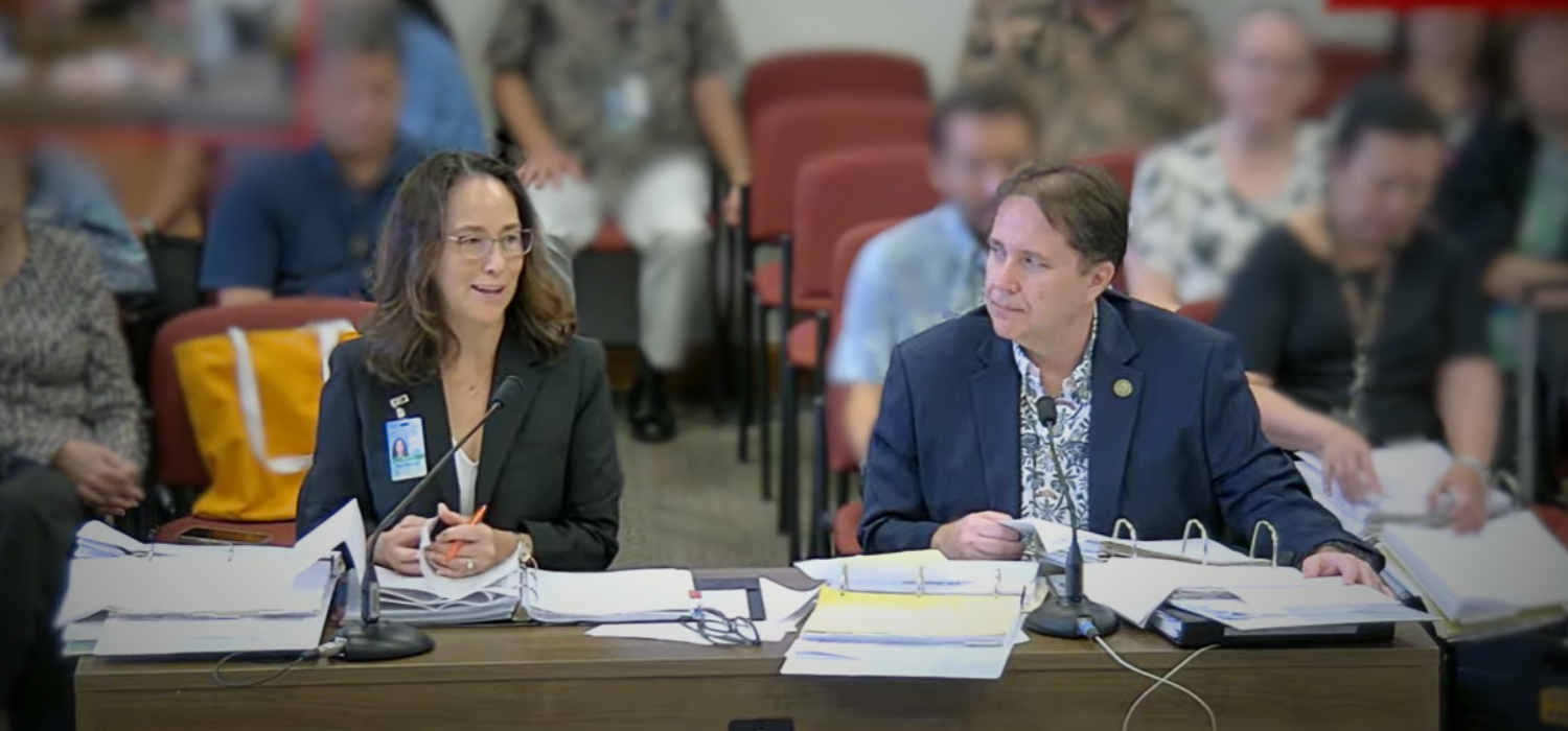 Executive sponsors Keith Regan, DAGS Comptroller, and Christine Sakuda, State CIO and ETS Administrator, are seated at a table as they meet with members of the the Senate Committee on Ways and Means and the House Committee on Finance.